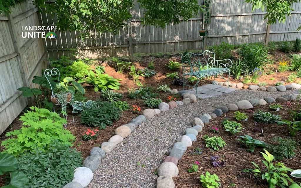 Raised rock flower beds: 14 ideas for low-maintenance beauty 7 Border rock beds along pathways