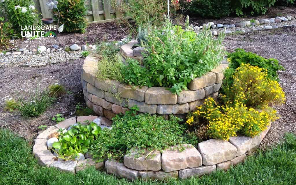 Raised rock flower beds: 14 ideas for low-maintenance beauty 8 Herb garden in stone