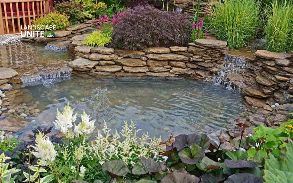 Raised rock flower beds: 14 ideas for low-maintenance beauty 10 Raised rock bed with water feature